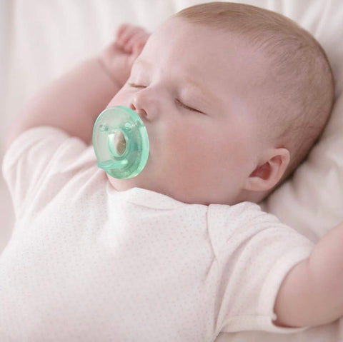 Baby sleeping with pacifier