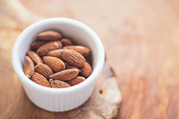 small white bowl with almonds