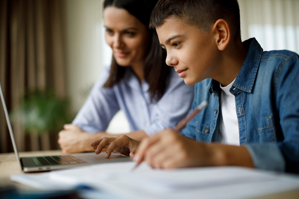 Mother teaching son about personal finance