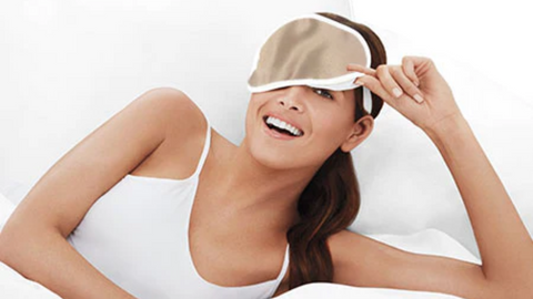 Woman wearing the Beauty Boosting Eye Mask from Tria