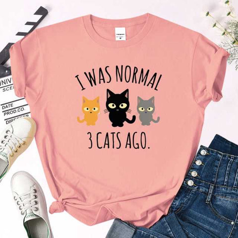 a pink color t-shirt specially designed for cat mom with quote i was normal 3 cats ago that is so funny and playful