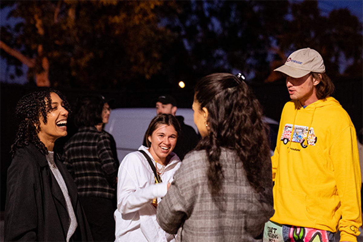 Guests laughing together on a patio