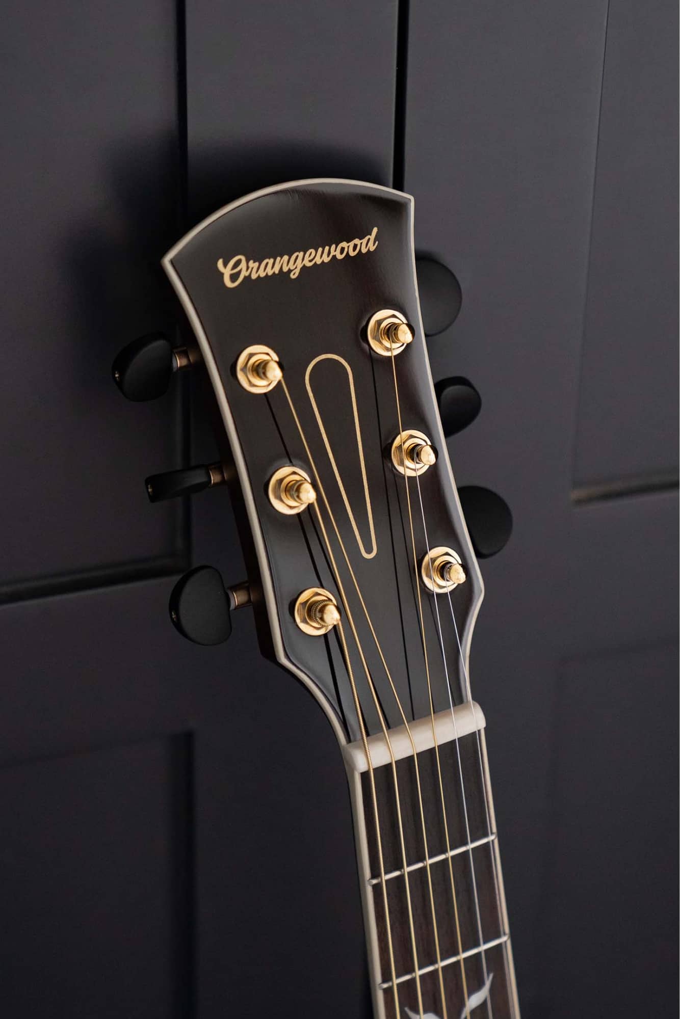 Orangewood guitar headstock with script logo