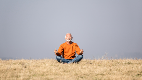 man meditating outdoors 