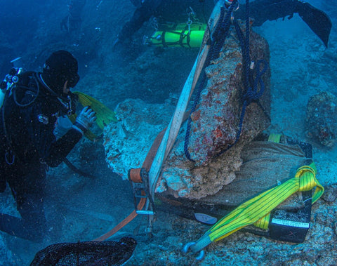 The lifting of the marble base of a statue from the sea bottom near the island of Antikythera. Credit: Greek Ministry of Culture