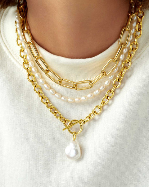 close up pearl and gold layering necklace