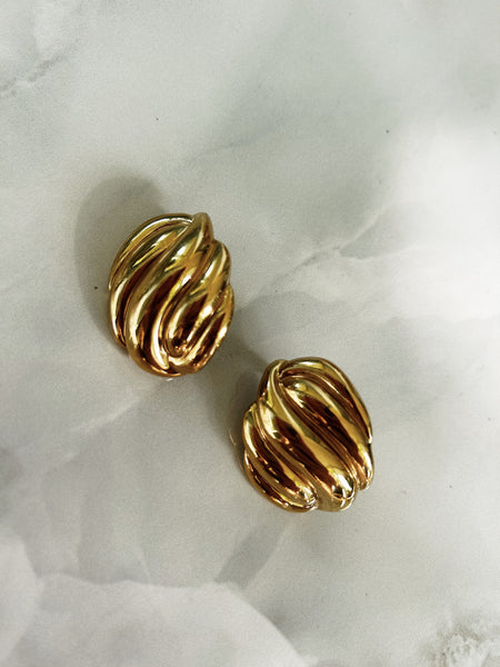 Gold Statement Earrings on flat lay