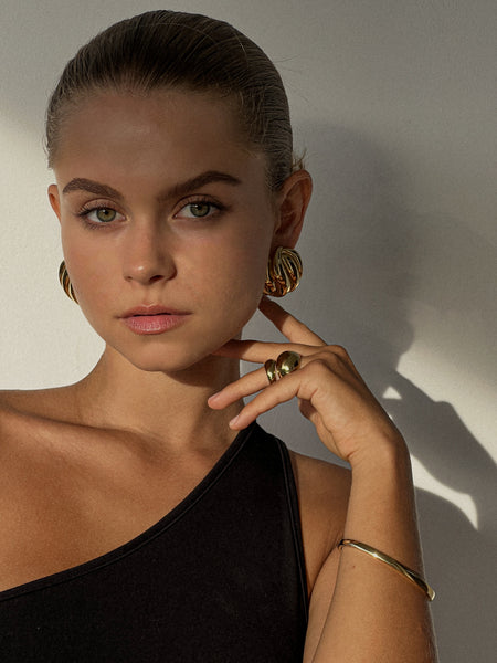 close up statement gold earrings