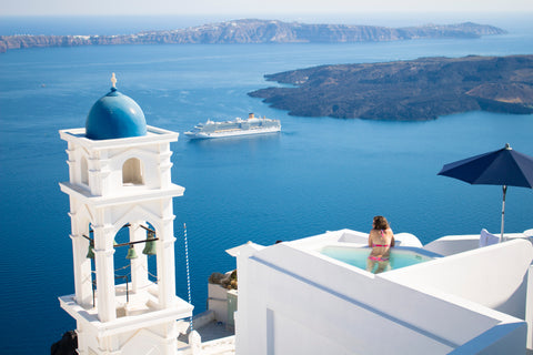 Santorini, photo by Orva Studio, the inspiration for the hot new niche fragrance brand The Bubble Collection now making waves in the beauty industry.