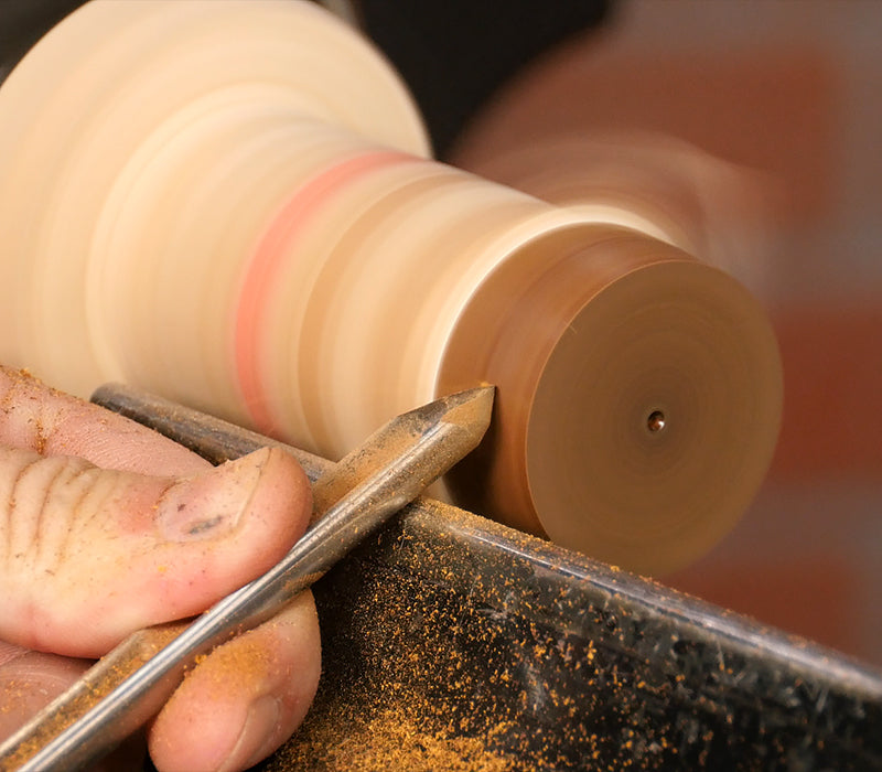 Turing the blank round with a spindle gouge.