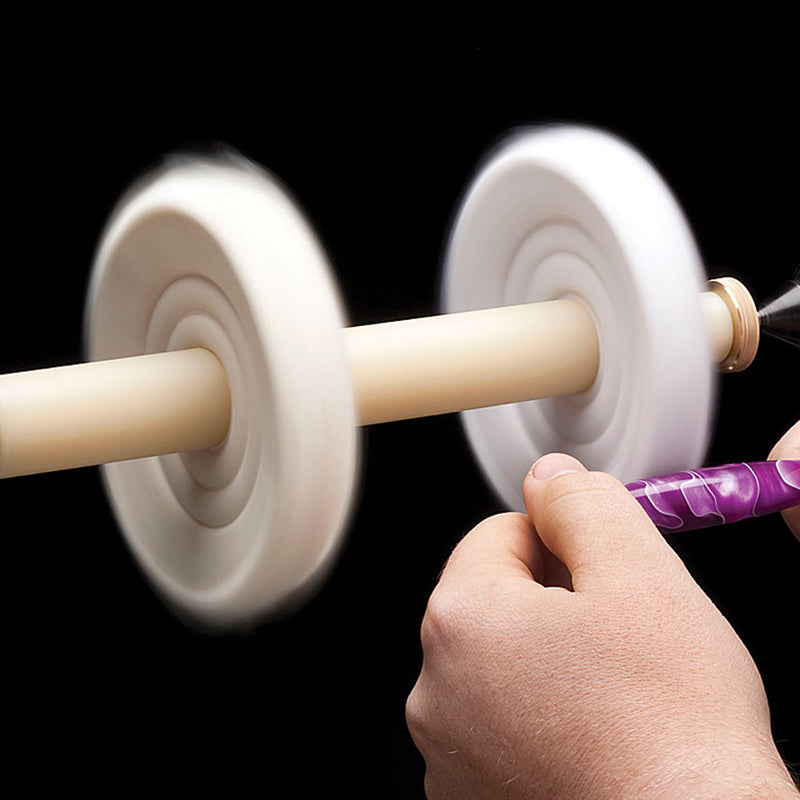 Buffing an acrylic blank on an cotton buffing wheel.