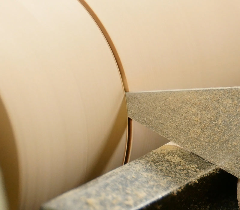 Cutting a groove with a narrow parting tool.