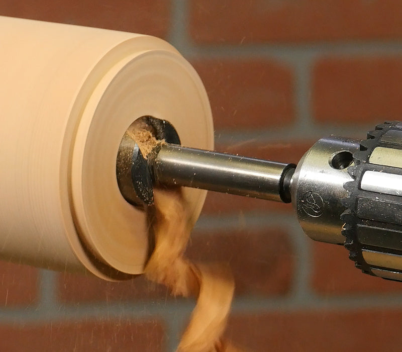 Drilling a hole with a forstner bit on the lathe.