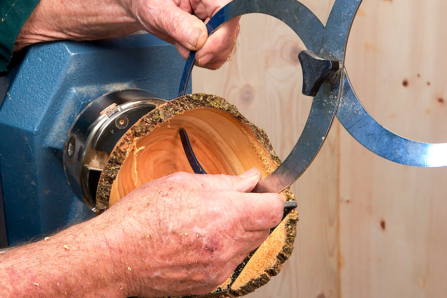 Measuring the wall thickness with bowl calipers.