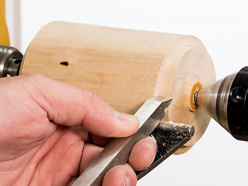 Turning a tenon with a beading parting tool.