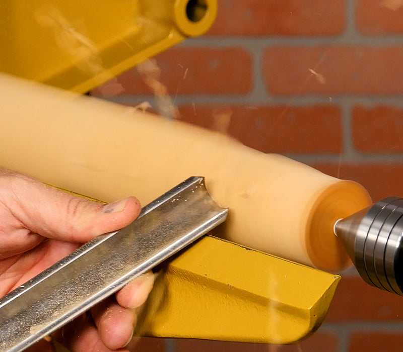 Turning blank to round with a spindle roughing gouge.