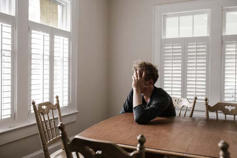 Man working at home stressing