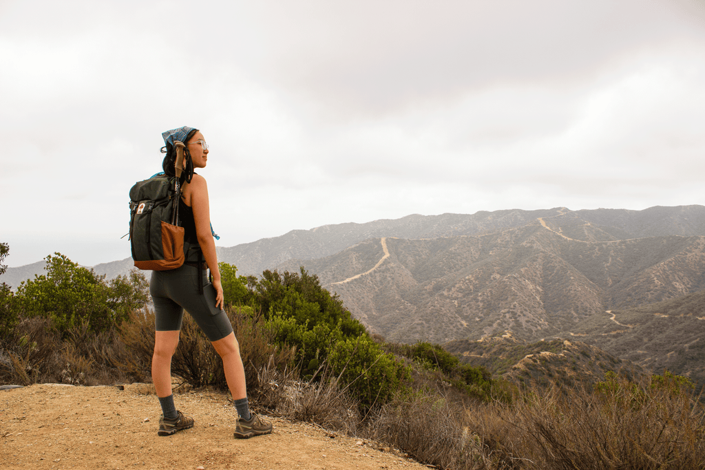 michelle on top of a mountain, overlooking the view