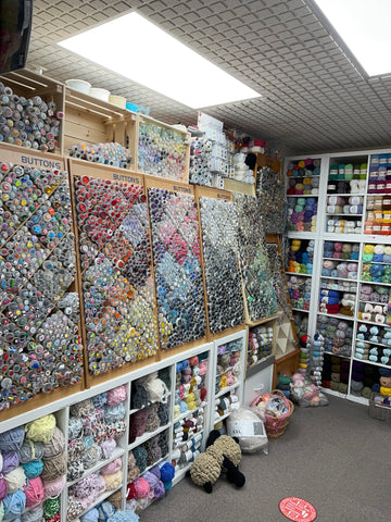 Tubes of colourful, individually sold buttons