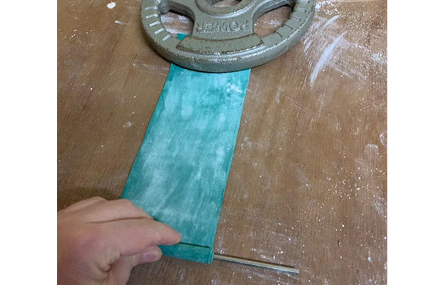 using weight to wrap steel