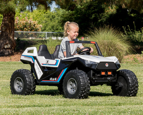 child riding the all wheel drive buggy in grass