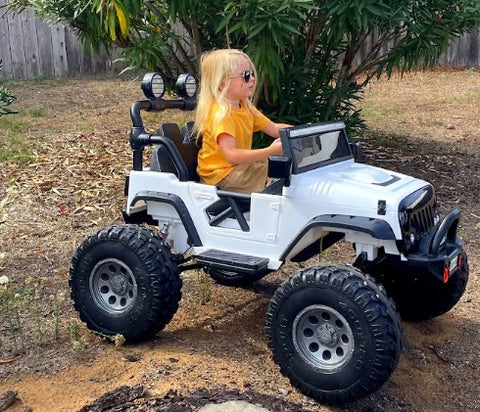 Child riding the 24V Lifted Jeep