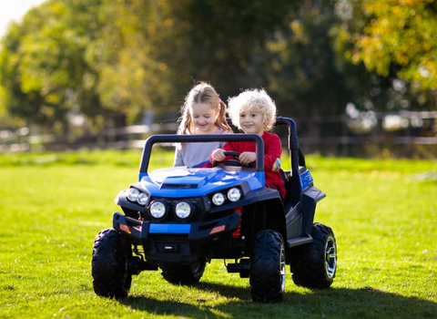 Two Children Happily Riding the 12V 2-Seater UTV Electric Power Wheels for Kids