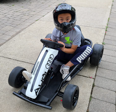 Kid wearing all safety gear while riding the drifter go kart
