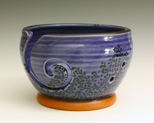 Ceramic yarn bowl. Glaze in a cobalt blue glaze with black swirl decoration. 