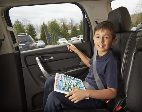 Boy in car playing Melissa & Doug License Plate Game