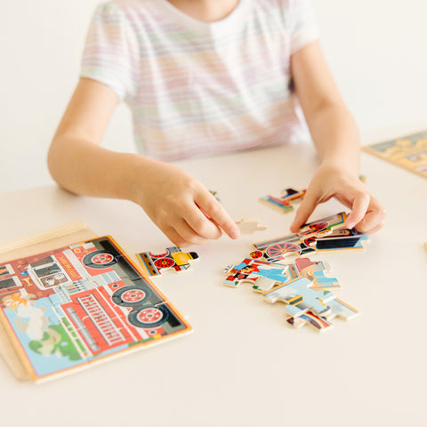 Child playing with Melissa & Doug Vehicles in a Box Jigsaw Puzzles