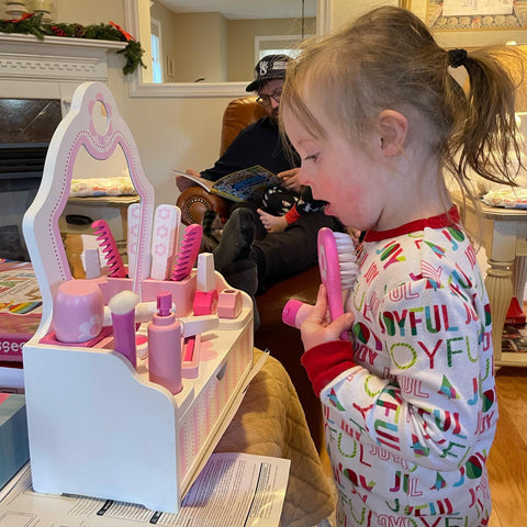 Girl playing with Melissa & Doug Beauty Salon