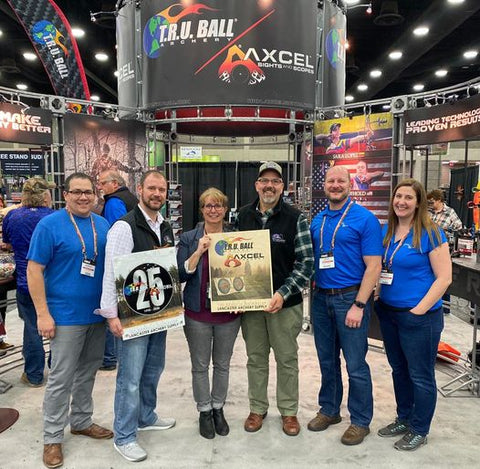 Rob Kaufhold, Carole Kaufhold, and Steve Yoder are presented with the T.R.U. Ball/ AXCEL Archery's #1 Domestic Distributor 2020 and 2021 awards. 