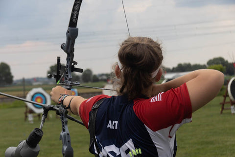 Alyssa Artz wearing a USAT jersey takes aim at the Lancaster Archery Supply Summer Sizzle.