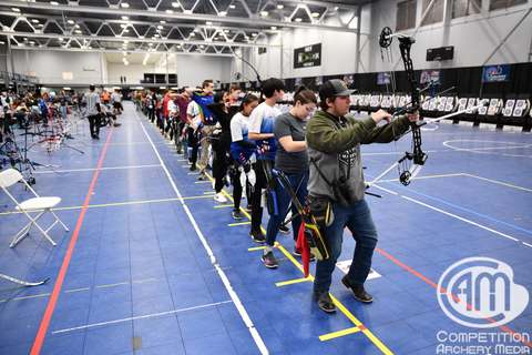 The shooting line at the Youth and Collegiate Trophy Tournament where archers stand and prepare to shoot.