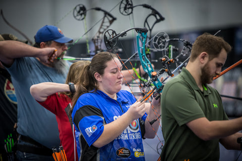 Bethany Lunger nocks her arrow onto her bow in preparation to shoot at the Lancaster Archery Classic.