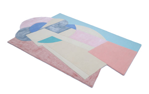 The Fun Rug by Ruggism for modern interiors. This rug has pink, blue and cream/beige colours, suitable for pink and grey interiors. 