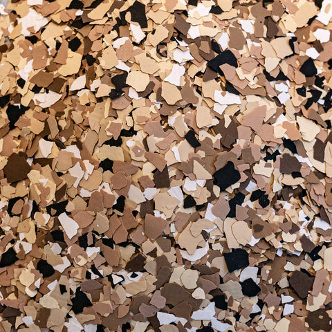 An image of vinyl flakes ready for a flake epoxy resin flooring installation.
