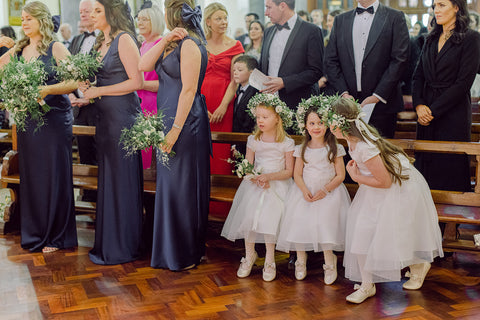 Flowergirls and Bridesmaids awaiting the arrival of the bride