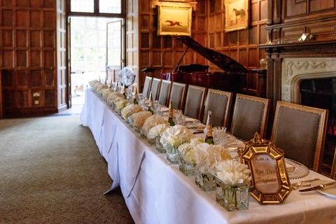 top table with flowers and Moet