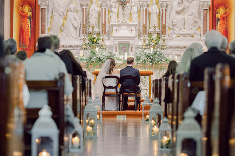 Bride and groom in the beautiful decorated Thomastown Church with candles along the Ilse