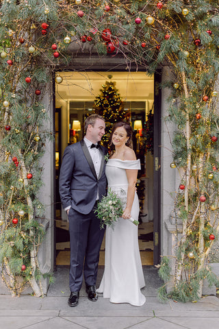 Bride and groom at the entrance of Mount Juliet for their Christmas Wedding