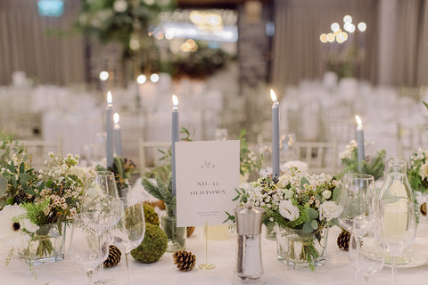 Wedding top table with delicate florals and pale blue candles in Mount Juliet