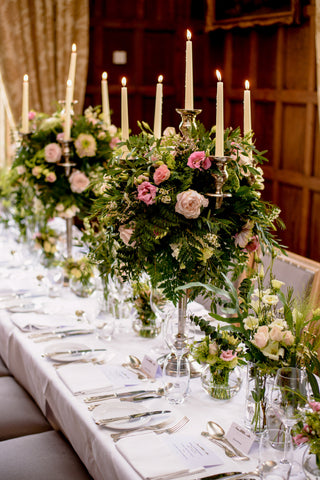 floral candelabras on wedding table for castle wedding