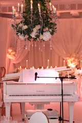 Floral Chandelier over Piano at Wedding reception