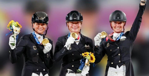 Dorothee Schneider with her Olympic gold medal, left. 