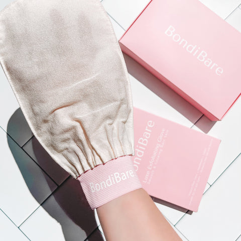 White Exfoliating Glove with pink packaging