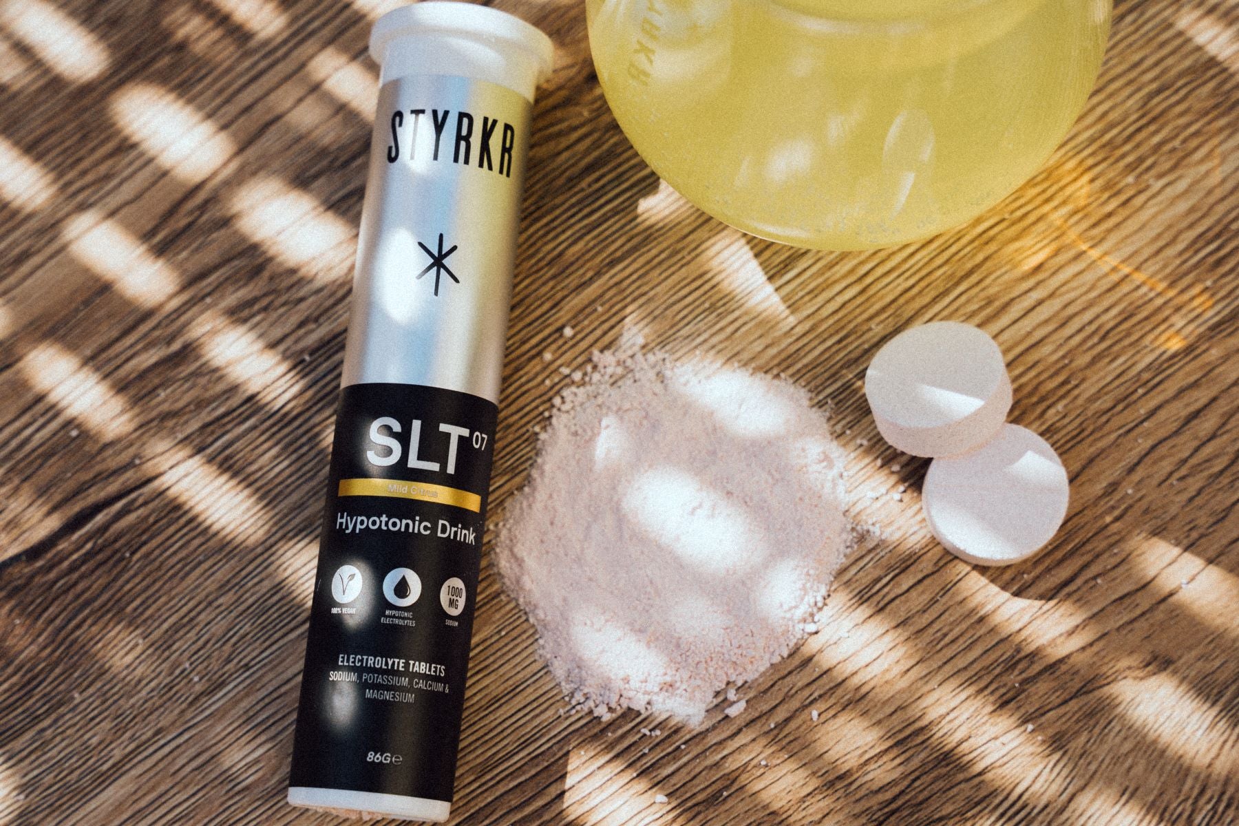 styrkr hydration tablets in a glass of water