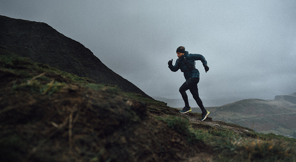 rich gill climbing a mountain in the peaks