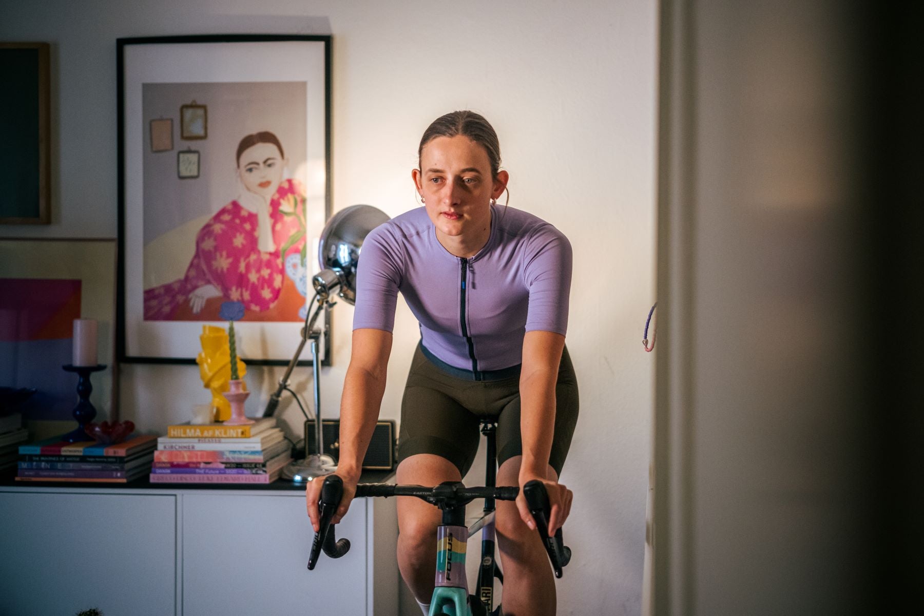 female athlete in purple turbo training at home